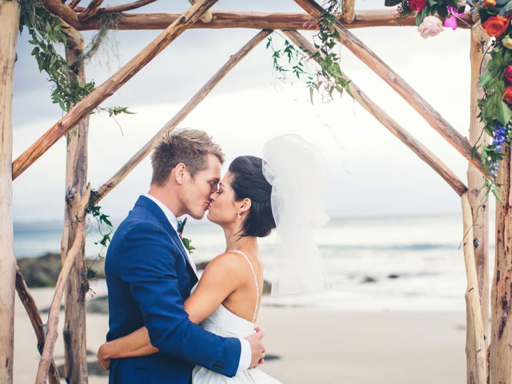 A Colourful Diy Beach Wedding In Australia Close Up Of Couple Kiss